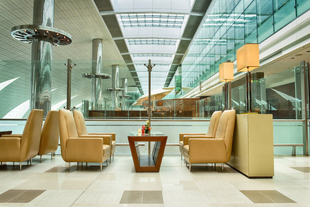 DUBAI, UAE - APRIL 18, 2014: business class lounge interior. Dubai International Airport is an international airport serving Dubai. It is a major airline hub in the Middle East, and is the main airport of Dubai.のeditorial素材