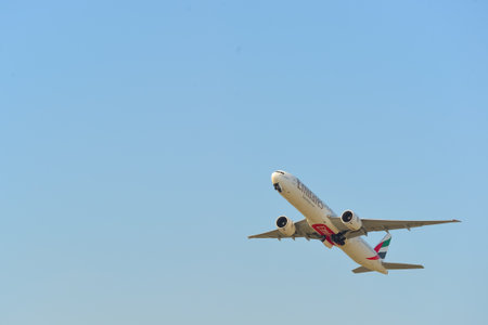 HONG KONG - APRIL 15, 2015: Emirates Boeing 777 take off. Emirates is one of two flag carriers of...