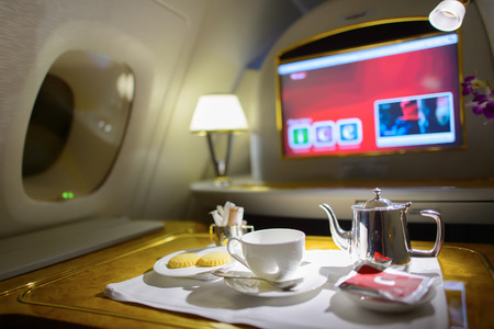 DUBAI, UAE - MARCH 31, 2015: Emirates first class interior. Emirates is one of two flag carriers of the United Arab Emirates along with Etihad Airways and is based in Dubai.のeditorial素材