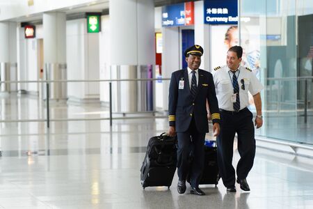 HONG KONG - APRIL 15, 2015: pilots of United Airlines after flight. United Airlines, Inc. is an...
