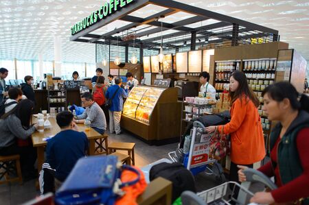 SHENZHEN, CHINA - FEBRUARY 16, 2015: Starbucks Cafe interior. Starbucks Corporation is an American...