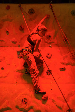 COLOGNE- SEP 19: woman climbing pending The Photokina Exhibition on September 20, 2014 in Cologne, Germany. The Photokina is the world's largest trade fair for the photographic and imaging industriesのeditorial素材