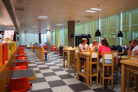 GENEVA - SEP 11: people in airport cafe on September 11, 2014 in Geneva, Switzerland. Geneva International Airport is the international airport of Geneva, Switzerland. It is located 4 km northwest of the city centreのeditorial素材