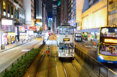 HONG KONG - JUNE 03, 2015: double-decker tram on street of HK. Hong Kong Tramways is a tram system in Hong Kong, being one of the earliest forms of public transport in the metropolis. Owned and operated by Veolia Transportのeditorial素材