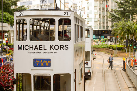 HONG KONG - JUNE 03, 2015: double-decker tram on street of HK. Hong Kong Tramways is a tram system in Hong Kong, being one of the earliest forms of public transport in the metropolis. Owned and operated by Veolia Transportのeditorial素材