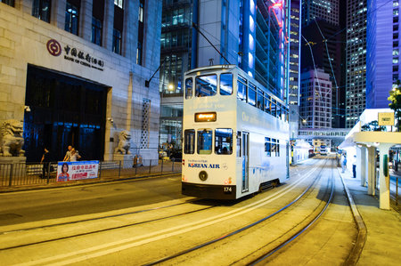 HONG KONG - JUNE 03, 2015: double-decker tram on street of HK. Hong Kong Tramways is a tram system in Hong Kong, being one of the earliest forms of public transport in the metropolis. Owned and operated by Veolia Transportのeditorial素材