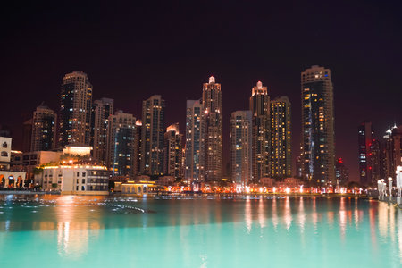 DUBAI - OCTOBER 13: area near the Dubai Fountain on October 13, 2014 in Dubai, UAE. The Dubai Fountain is the world's largest choreographed fountain system set on the 30-acre manmade Burj Khalifa Lake, at the center of the Downtown Dubai development in Duのeditorial素材