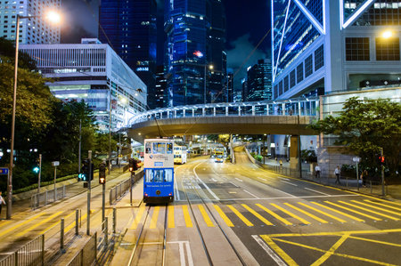 HONG KONG - JUNE 03, 2015: double-decker tram on street of HK. Hong Kong Tramways is a tram system in Hong Kong, being one of the earliest forms of public transport in the metropolis. Owned and operated by Veolia Transportのeditorial素材