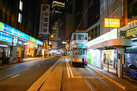 HONG KONG - JUNE 03, 2015: double-decker tram on street of HK. Hong Kong Tramways is a tram system in Hong Kong, being one of the earliest forms of public transport in the metropolis. Owned and operated by Veolia Transportのeditorial素材
