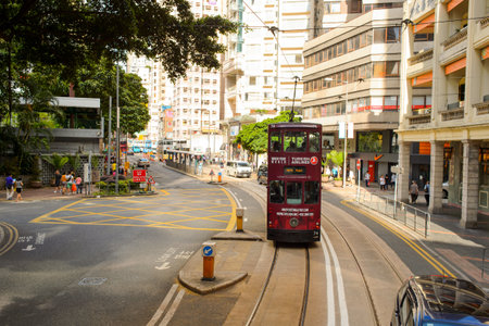 HONG KONG - JUNE 03, 2015: double-decker tram on street of HK. Hong Kong Tramways is a tram system in Hong Kong, being one of the earliest forms of public transport in the metropolis. Owned and operated by Veolia Transportのeditorial素材
