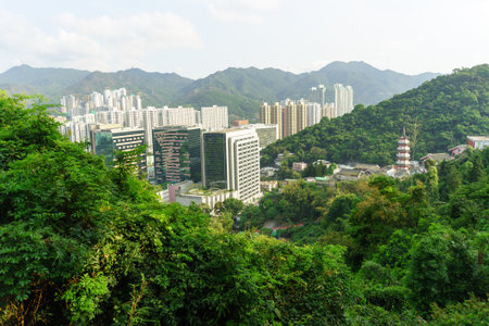 HONG KONG - APRIL 17, 2015: view on Sha Tin from the hill. Sha Tin, also spelt Shatin, is an area around the Shing Mun River in the New Territories of Hong Kong. Administratively, it is part of the Sha Tin District.のeditorial素材