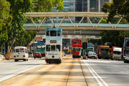 HONG KONG - JUNE 03, 2015: double-decker tram on street of HK. Hong Kong Tramways is a tram system in Hong Kong, being one of the earliest forms of public transport in the metropolis. Owned and operated by Veolia Transportのeditorial素材