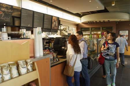 HONG KONG - APRIL 16, 2015: Starbucks cafe on Avenue of Stars. Starbucks is the largest coffeehouse...