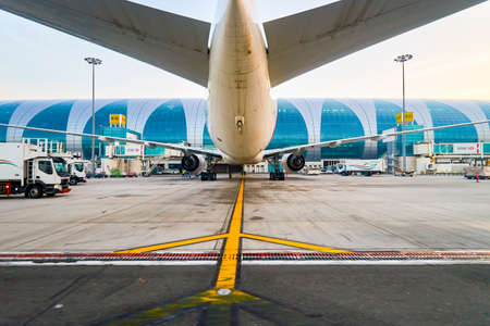 DUBAI, UAE - MARCH 30, 2015: Boeing-777 docked in Dubai airport. Dubai International Airport is an international airport serving Dubai. It is a major airline hub in the Middle East, and is the main airport of Dubai.のeditorial素材
