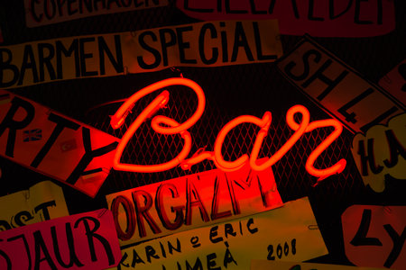 Neon shining signboard at nightの写真素材