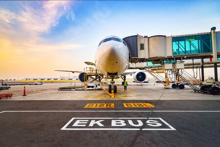 Jet aircraft docked in Dubai International Airport.