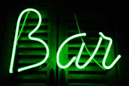 Neon shining signboard at nightの写真素材