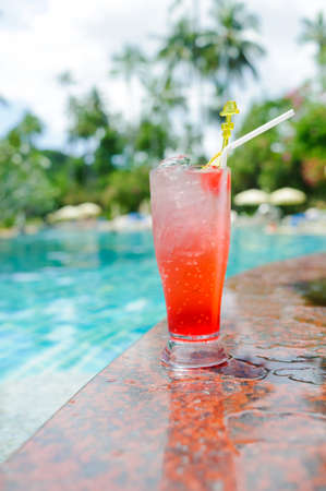 cool refreshing coctail near swimming pool on vacation