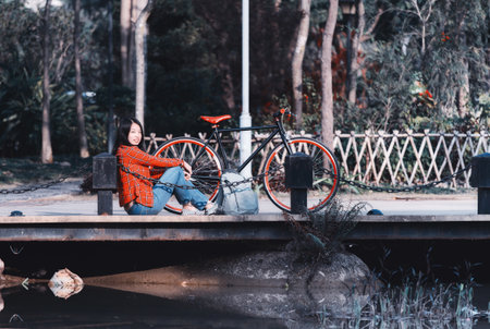 Pretty young chinese woman in the park in the daytimeの写真素材
