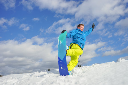 young man take fun on the snowboardの写真素材