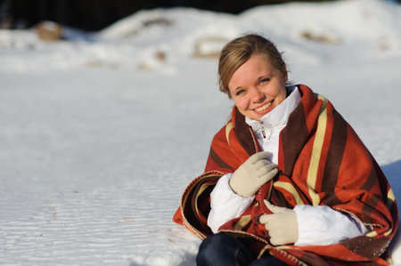 Young pretty woman in the park in winter timeの写真素材