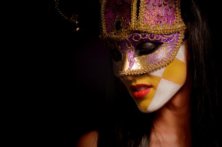 close up portrait of beauty young woman in venice maskの写真素材