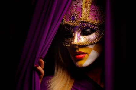 close up portrait of beauty young woman in venice maskの写真素材