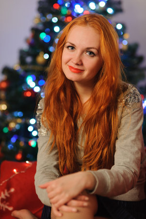Studio shot of beautiful young woman during christmas holidaysの写真素材