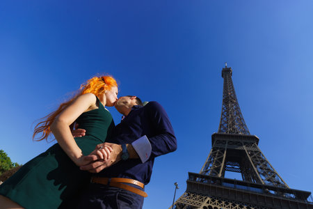 pretty young enamoured and beauty caucasian couple in Parisの写真素材