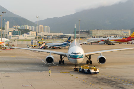 HONG KONG - APRIL 17: jet aircraft in airport on April 17, 2014 in Hong Kong. Hong Kong International Airport  is one of the best airport in the annual passenger survey by Skytrax.のeditorial素材