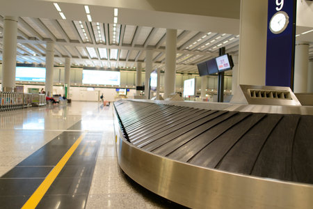 HONG KONG - APRIL 01: Baggage claim area on April 01, 2014 in Hong Kong, China. Hong Kong International Airport is one of the best airport in the annual passenger survey by Skytrax.のeditorial素材