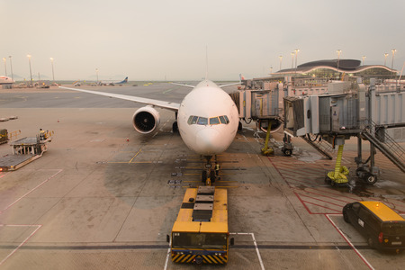 HONG KONG - APRIL 22: Boeing 777 docked in airport on April 22, 2014 in Hong Kong. Hong Kong International Airport  is one of the best airport in the annual passenger survey by Skytrax.のeditorial素材