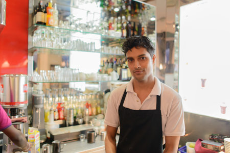 KUALA LUMPUR-APRIL 24: waiter in Espressamente Illy cafe on April 24, 2014 in Kuala Lumpur, Malaysia. Illycaffe is an Italian coffee roasting company that specializes on the production of espresso.のeditorial素材