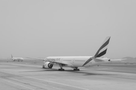 DUBAI - MAY 23: Emirates flights at Dubai Airport on May 23, 2012 in Dubai, UAE. Emirates handles major part of passenger traffic and aircraft movements at the airport.のeditorial素材