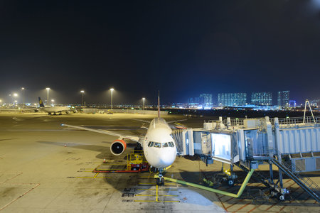 HONG KONG - APRIL 22: Boeing 767 docked in airport on April 22, 2014 in Hong Kong. Hong Kong International Airport  is one of the best airport in the annual passenger survey by Skytrax.のeditorial素材