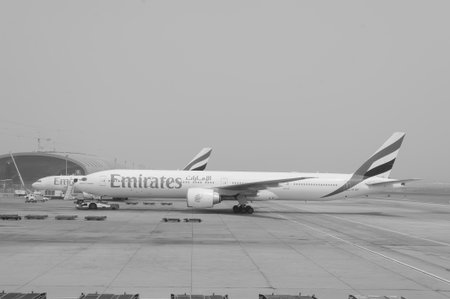 DUBAI - MAY 23: Emirates flights at Dubai Airport on May 23, 2012 in Dubai, UAE. Emirates handles major part of passenger traffic and aircraft movements at the airport.のeditorial素材