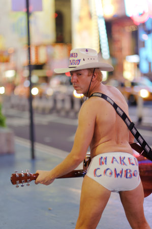 NEW YORK - SEPTEMBER 28: naked cowboy at area near Times Square at night on September 28, 2011 in New-York, USA. Naked Cowboy, is an American street performer whose pitch is on New York City's Times Squareのeditorial素材