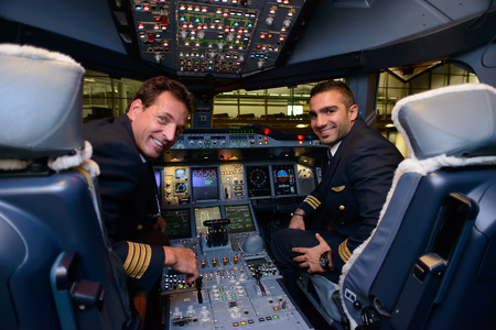 HONG KONG, CHINA - MAY 16, 2014: pilots in Emirates Airbus A380 aircraft after landing MAY 16, 2014. Emirates is the largest airline in the Middle Eastのeditorial素材