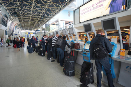 HELSINKI - SEP 03: self check-in kiosks in Helsinki Airport on September 03, 2014 in Helsinki,...