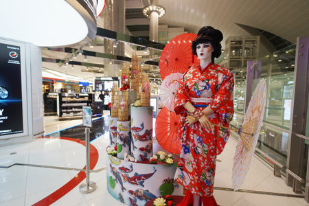 DUBAI, UAE - SEPTEMBER 26: japanese geisha mannequin in Duty Free shop in Dubai Airport on September 26, 2013 in Dubai, UAE. Emirates handles major part of passenger traffic and aircraft movements at the airport.のeditorial素材