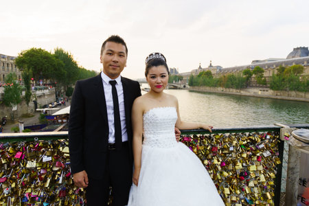 PARIS - SEPTEMBER 06: wedding photo in center of Paris on September 06, 2014 in Paris, France. Paris, aka City of Love, is a popular travel destination and a major city in Europeのeditorial素材