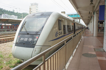 GUANGZHOU, CHINA-MAY 14: train arrives at Guangzhou reaiway station on May 14, 2013 in Guangzhou,...