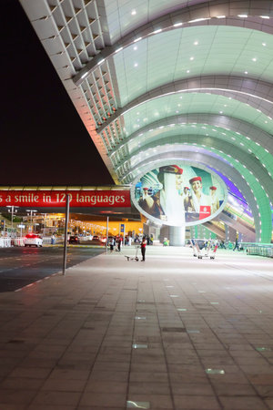 DUBAI - MARCH 26: Dubai Airport entrance on March 26, 2013. It is world largest building by floor space and world largest airport terminal.のeditorial素材