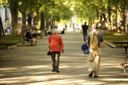 DRESDEN - MAY 13: people walking in the park on May 13, 2009 in Dresden, Germany. Dresden is the capital city of the Free State of Saxony in Germany. It is situated in a valley on the River Elbe, near the Czech border.のeditorial素材