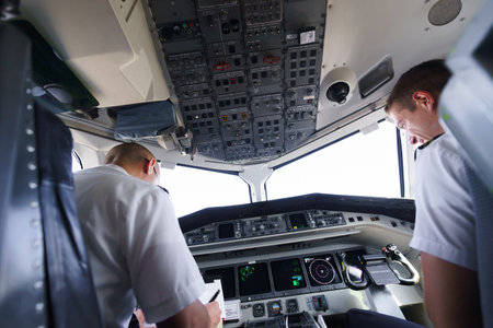 GENEVA - SEPTEMBER 16: Etihad Regional pilots in aircraft cockpit on September 16, 2014 in Geneva, Switzerland. Darwin Airline, operating under the brand name Etihad Regional since January 2014のeditorial素材