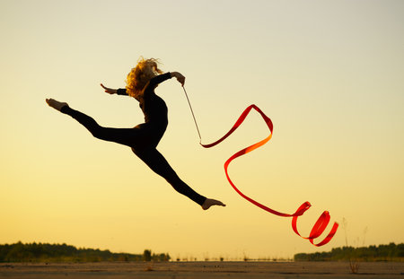 Professional gymnast woman dancer with ribbonの写真素材