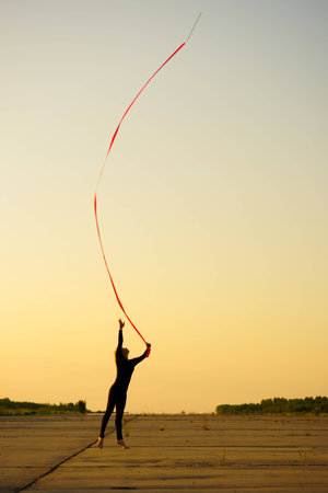 Professional gymnast woman dancer with ribbonの写真素材