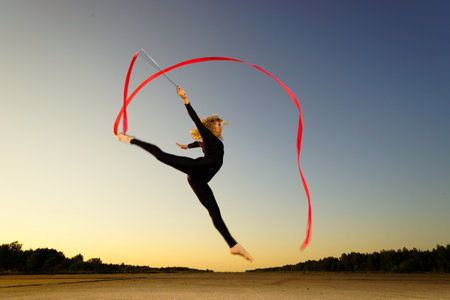 Professional gymnast woman dancer with ribbonの写真素材