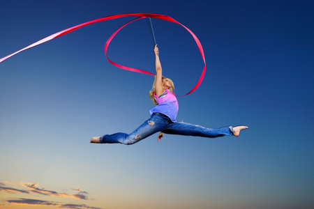 Professional gymnast woman at nightの写真素材