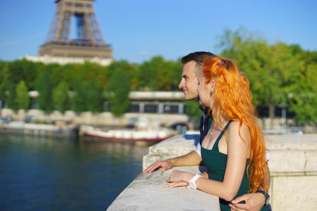 pretty young enamoured and beauty caucasian couple in Parisの写真素材